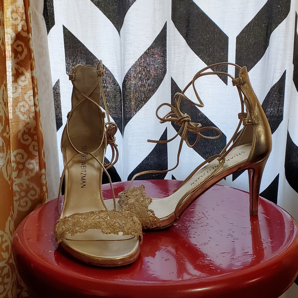 Stuart Weitzman gold gladiator sandles.